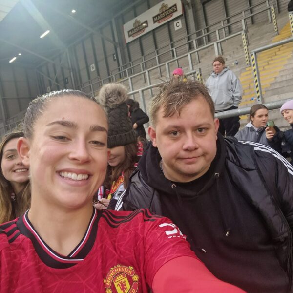 Lee with Women's Manchester United football player