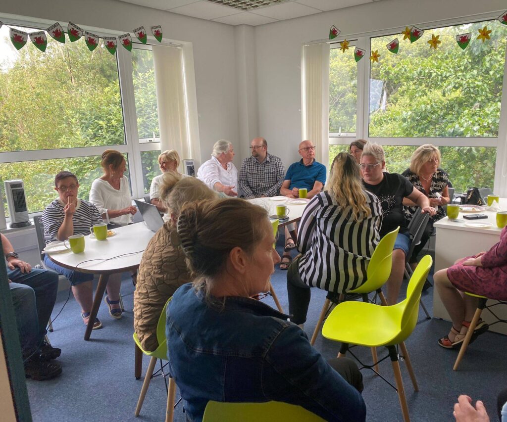 shared lives carers and team members gather together to watch the awards