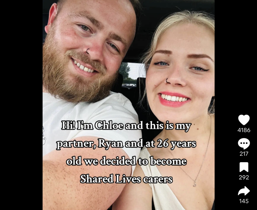 Chloe and Ryan smile at the camera overlayed onto the selfie is a paragraph that reads 'Hi. I'm Chloe and this is my partner, Ryan and at 26 years old we decided to become Shared Lives carers'. It's a screenshot of a TikTok that went viral.